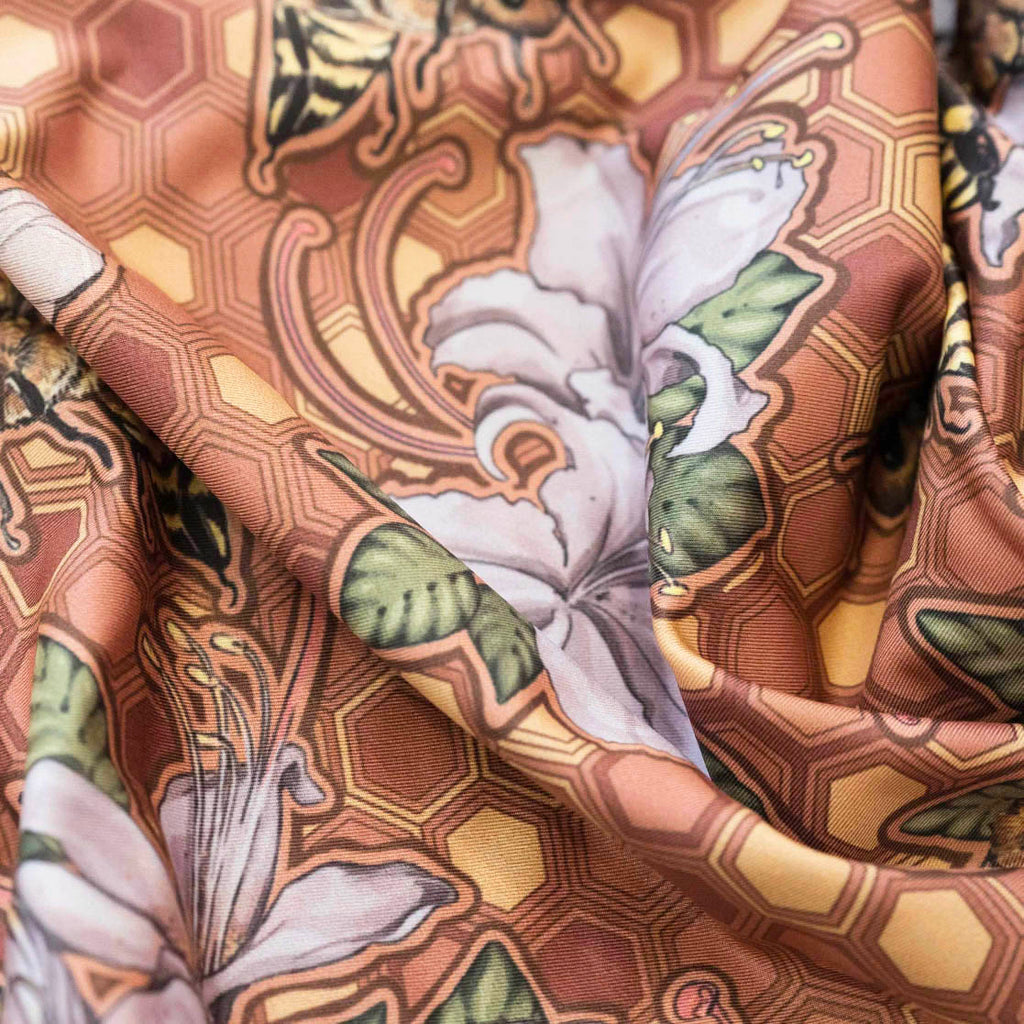zoomed-in shot of our new featherlight fabric with honeybees printed artwork.