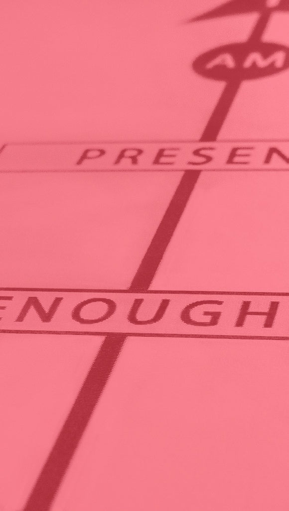 Closeup view of pink yoga mat affirmation writing