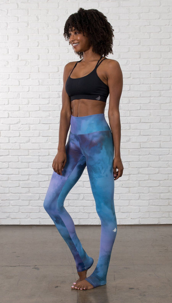 front view of model wearing full length leggings with tanzanite watercolor printed design