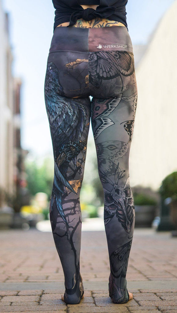 close up front view of model wearing mashup gothic themed printed full length leggings