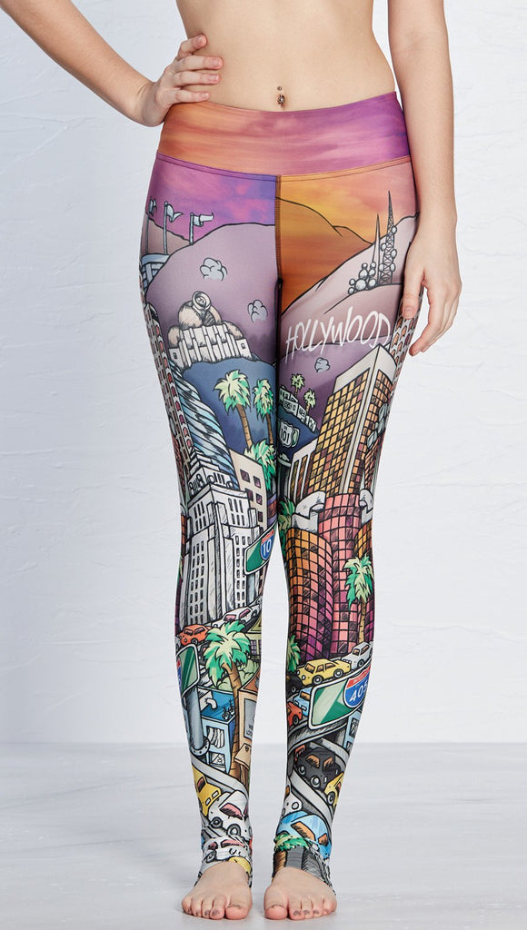 close up front view of model wearing los angeles themed printed full length leggings