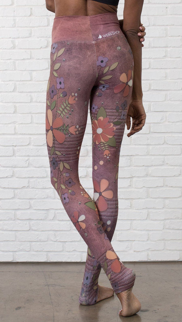 close up back view of model wearing vintage flower pattern printed full length leggings