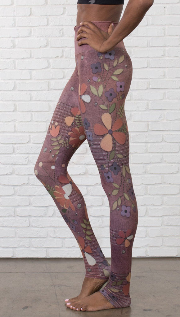 close up left side view of model wearing vintage flower pattern printed full length leggings