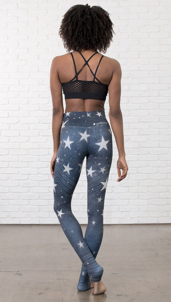 back view of model wearing vintage patriotic stars design full length leggings