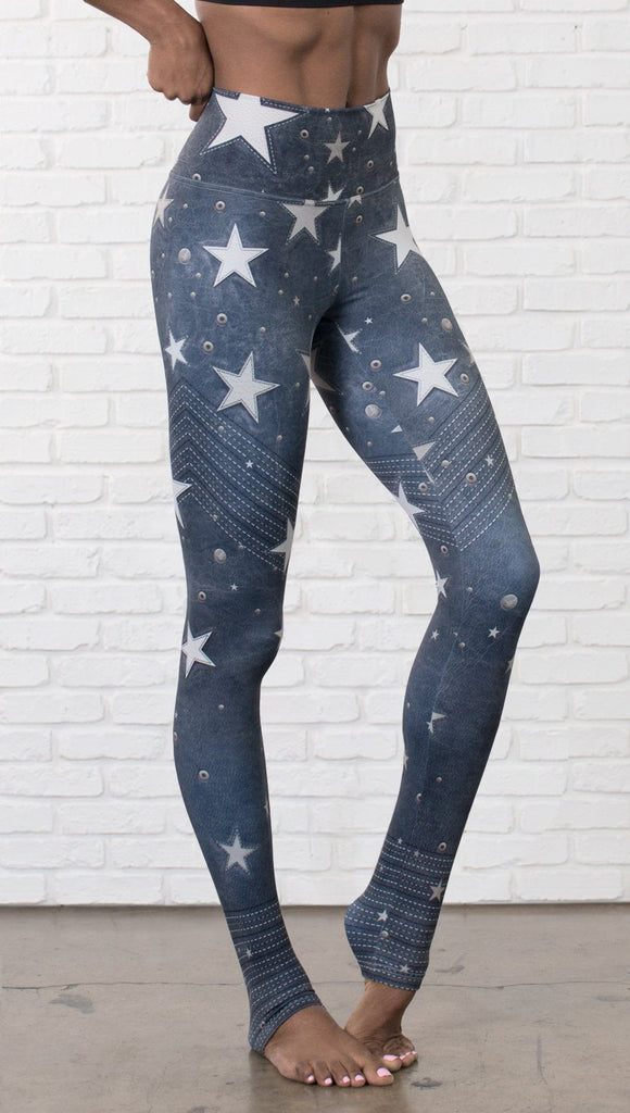 closeup right side view of model wearing vintage patriotic stars design full length leggings