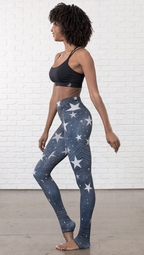 left side view of model wearing vintage patriotic stars design full length leggings