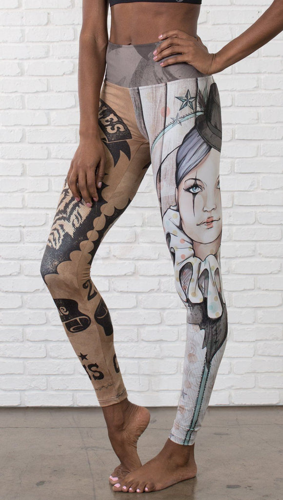 closeup front view of model wearing circus design mashup printed full length leggings