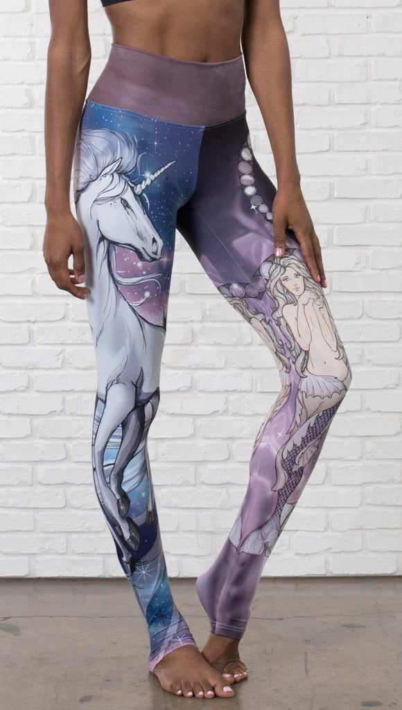 closeup front view of model wearing full length leggings with unicorn and mermaid mashup printed design