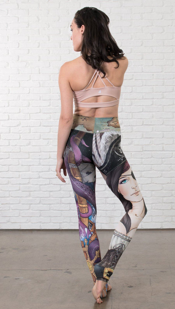back view of model wearing pirate girl mashup themed printed capri leggings