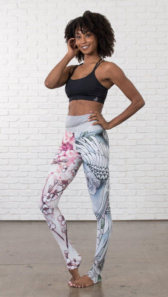 front view of model wearing Cherry Blossom, Swooping Crane and Koi Fish themed printed full length leggings