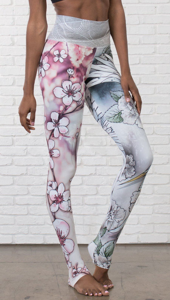 closeup front view of model wearing Cherry Blossom, Swooping Crane and Koi Fish themed printed full length leggings
