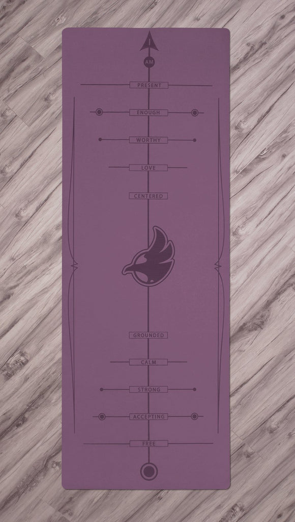 Top view of purple yoga mat with werkshop logo
