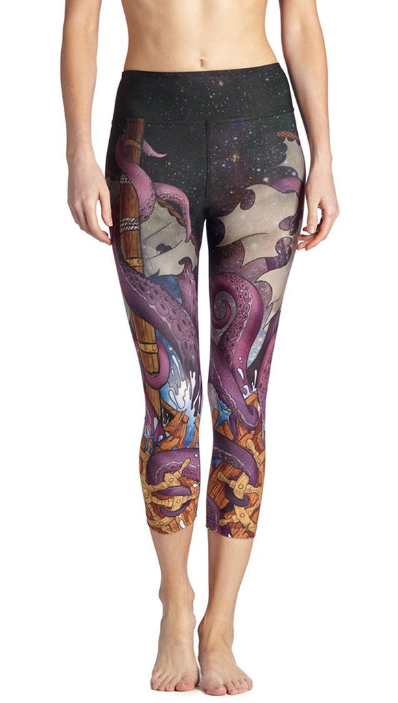 closeup front view of model wearing mythical octopus themed printed capri leggings