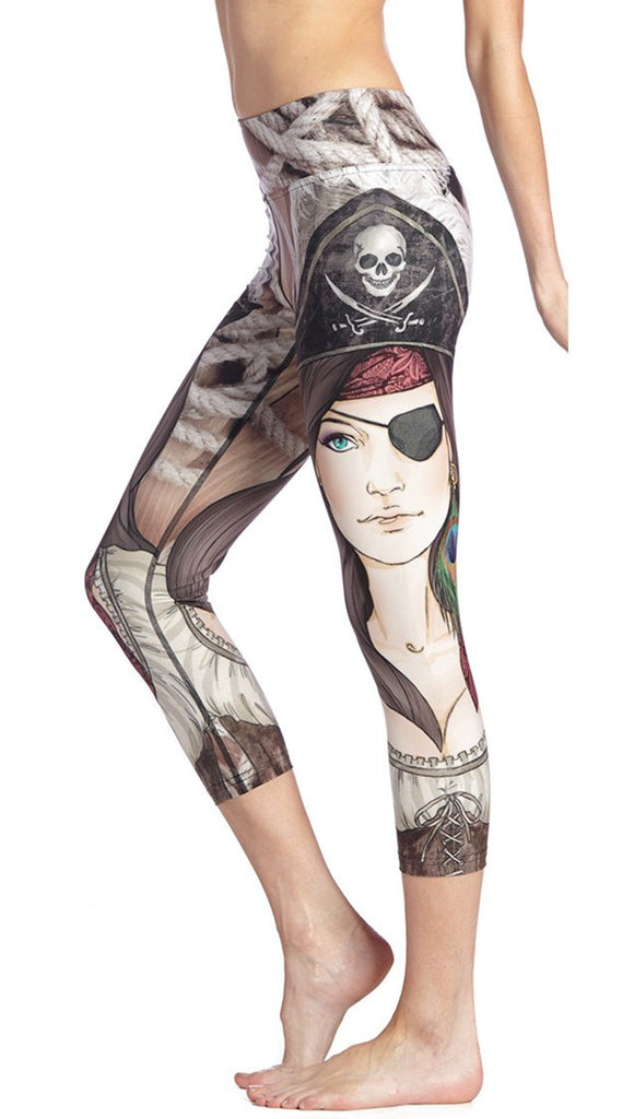 close up side view of model wearing pirate girl themed printed capri leggings