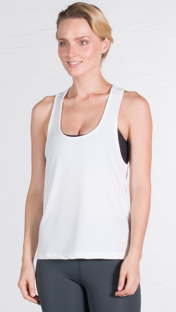 closeup front view of model wearing white sports tank top