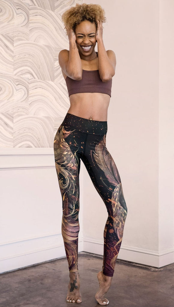 front view of model wearing phoenix themed full length leggings