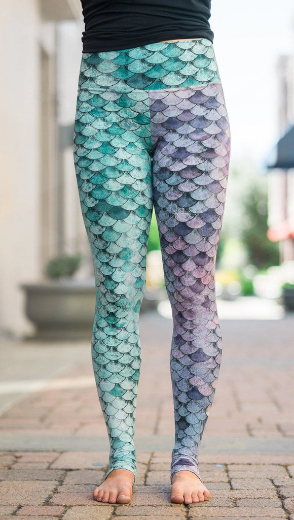 closeup front view of model wearing mermaid scales design printed full length leggings