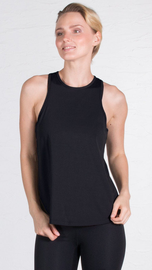 closeup front view of model wearing black tie back sports tank top
