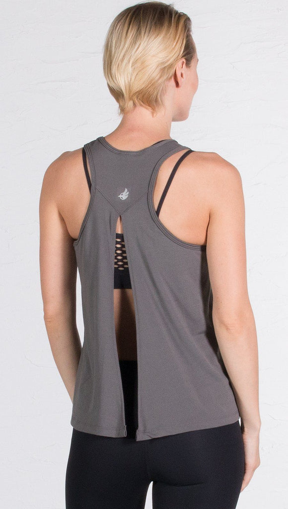 closeup back view of model wearing gray tie back sports tank top