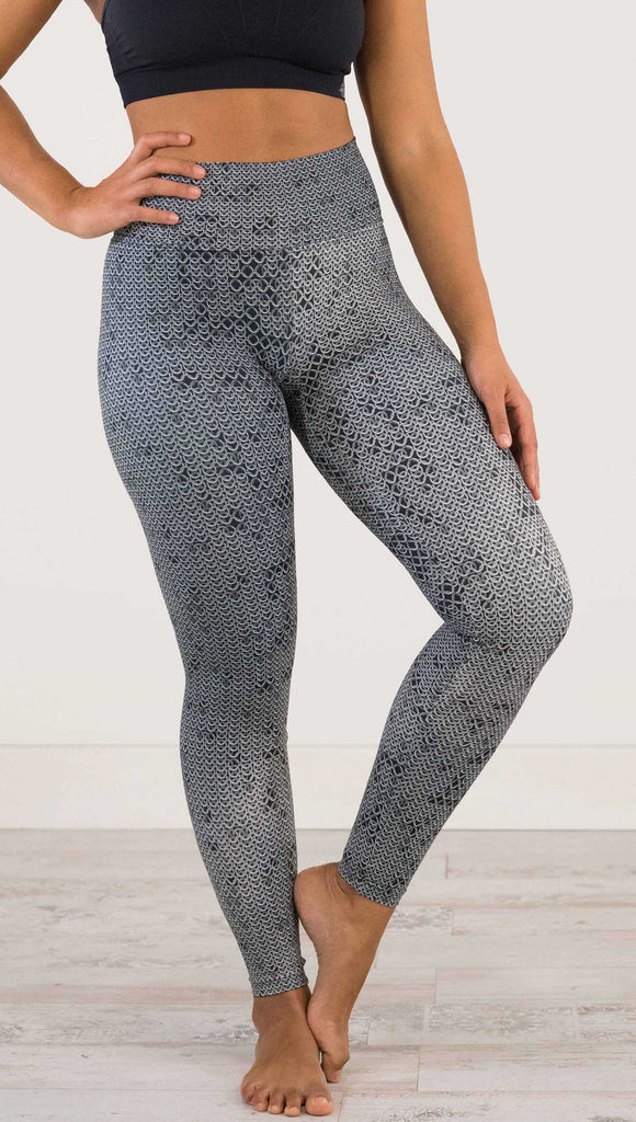 Waist down and front view of model wearing WERKSHOP Chainmaille Athleisure Leggings. The leggings are printed with a photo-real image of actual chainmaille. Perfect for a Renaissance Festival.