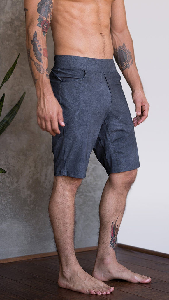 closeup right side view of model wearing slate mens performance shorts