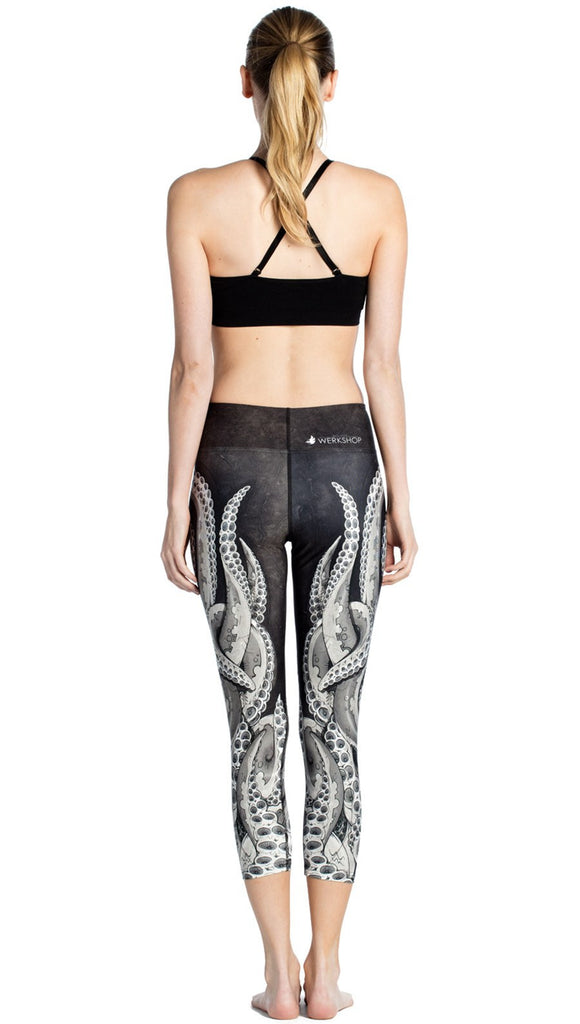 Back view of black and white tentacle themed printed capri leggings