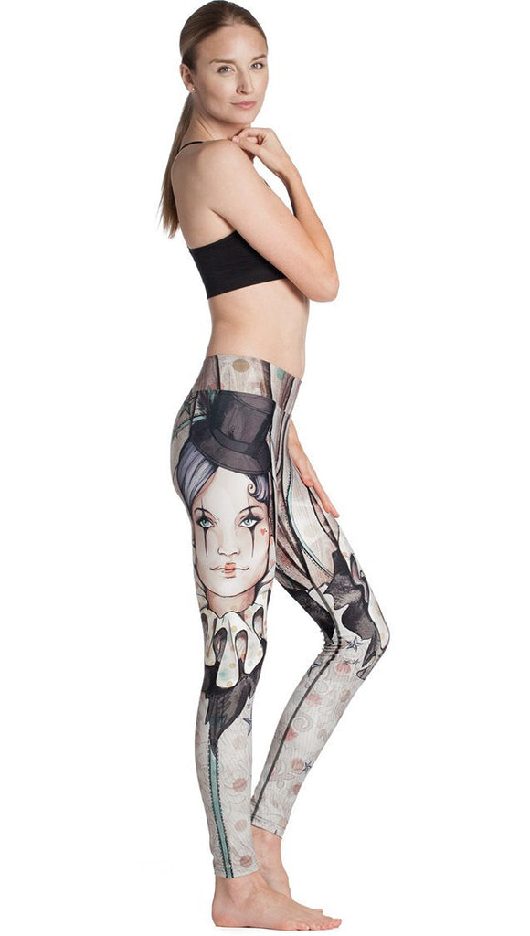 right side view of model wearing circus girl themed printed full length leggings