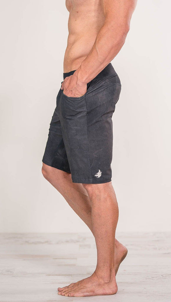 close up left side view of model wearing gray mens performance shorts