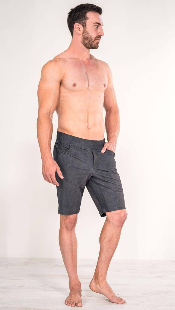 Front view of model wearing gray men's performance shorts