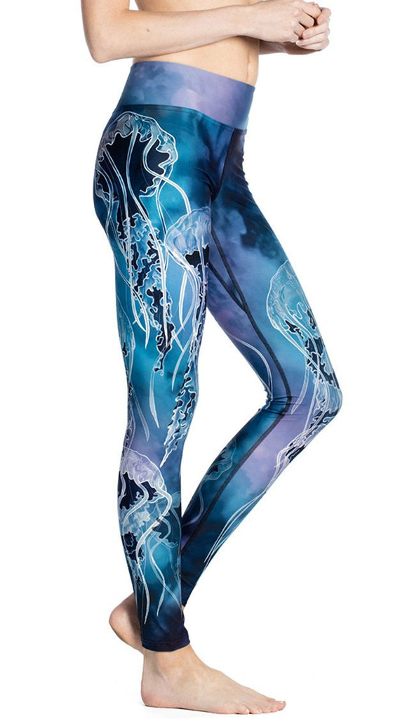 close up right side view of model wearing jellyfish themed printed full length leggings