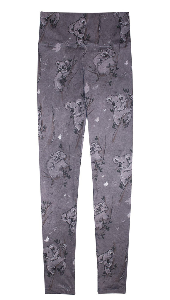 Koala leggings with tree branches and leaves on top of white background