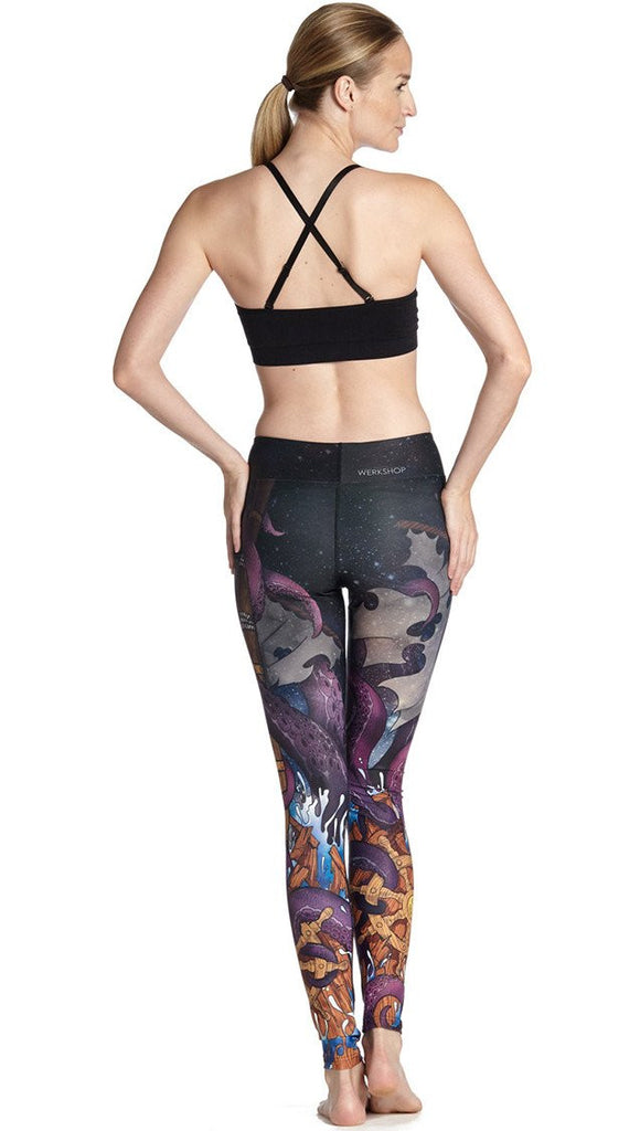 back view of model wearing mythical octopus themed printed full length leggings