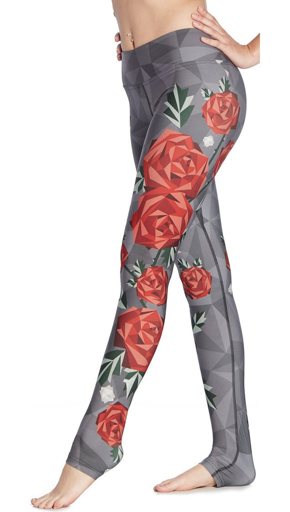 close up left side view of model wearing polygon roses themed printed full length leggings