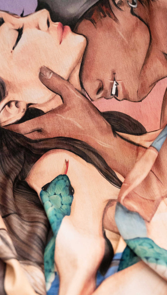 Zoomed in image of Officially Licensed WERKSHOP X The Ever King Tapestry/Blanket. "The Serpent and the Singbird" The artwork features Erik Bloodsinger passionately kissing Livia in front of a porthole window with a rope wrapping aroung it and the quote, "Hate me all you want, but don't regret me"