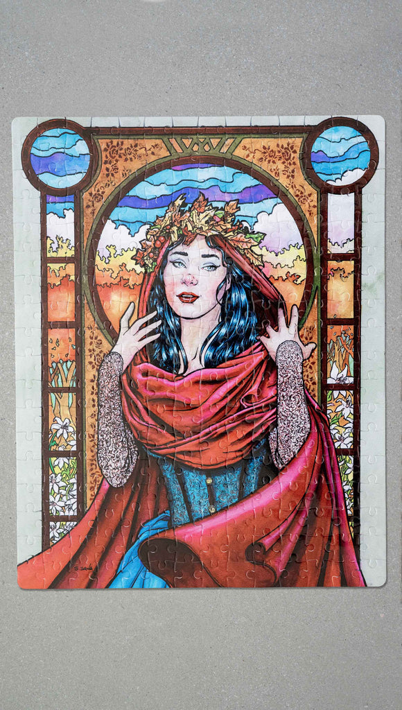Art Nouveau Puzzle featuring original artwork by Scott Christian Sava. The painting features a woman with a cloak and crown of autumn leaves standing in front of a stained glass window.