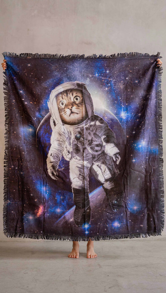 Decorative Chenille Tapestry printed with limited edition artwork by our Female Founder, Chriztina Marie. The artwork features an adorable domestic house cat wearing an astronaut uniform, floating in outer space with a nebula behind him. 