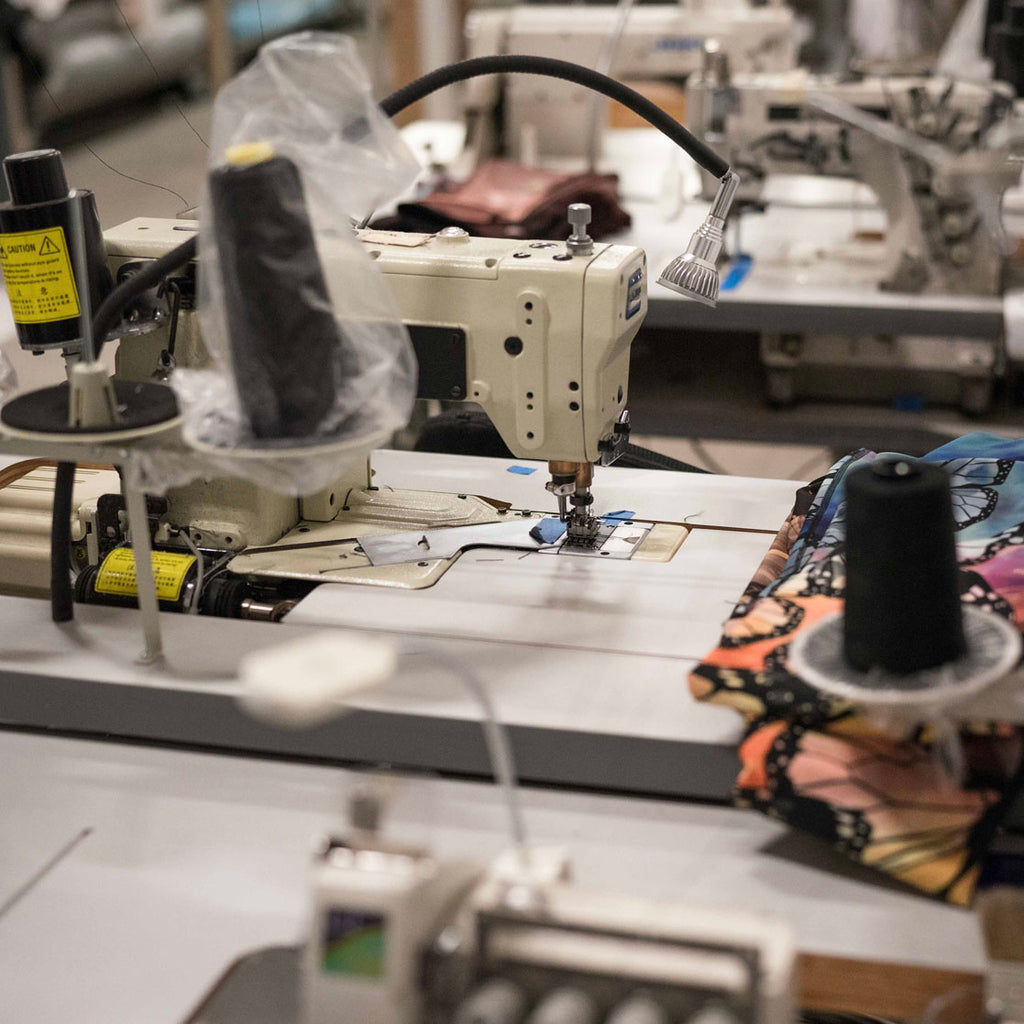 Close up photo of sewing machines at our local manufacturing partners' plant. 