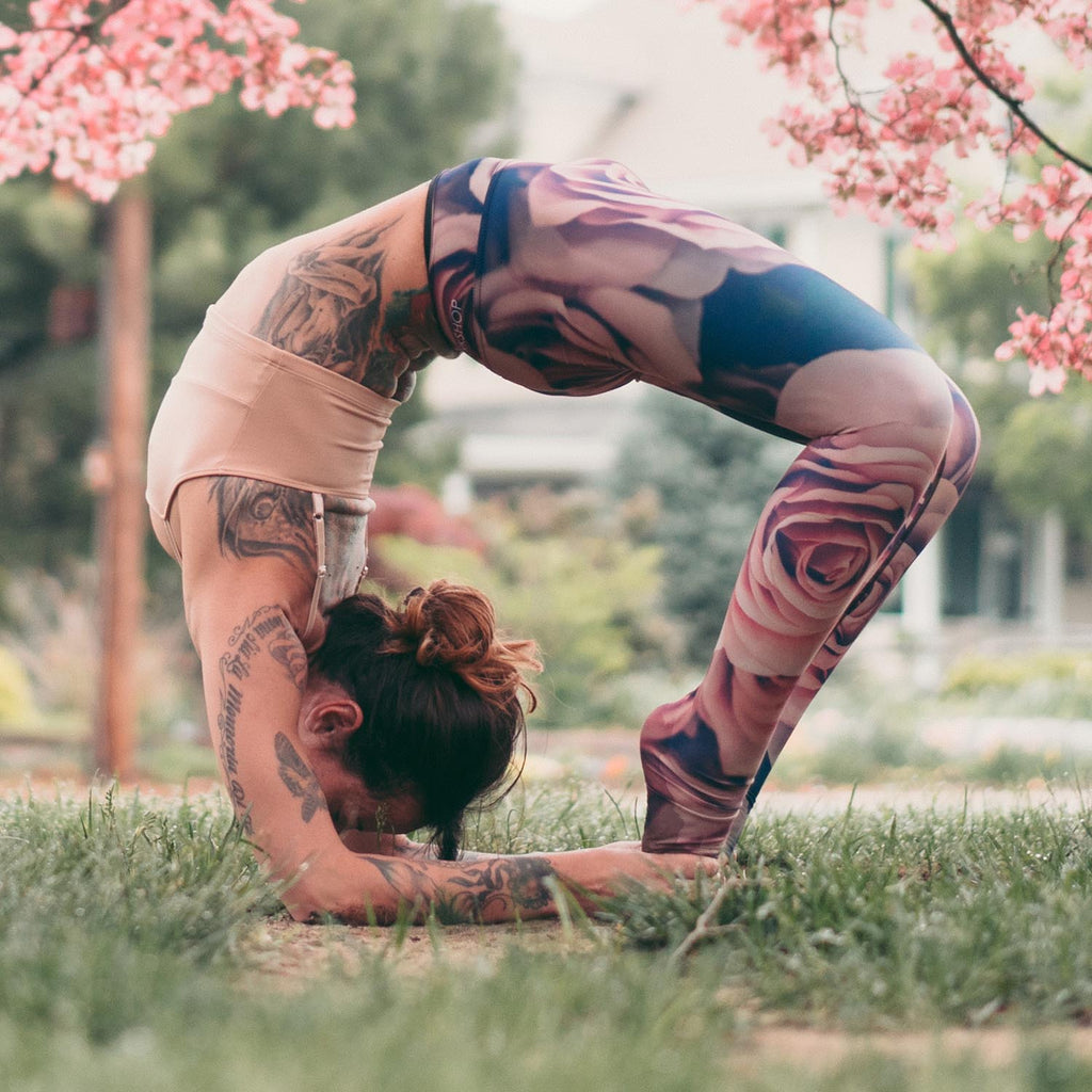 girl doing an advanced yoga pose while wearing WERKSHOP Blush Leggings