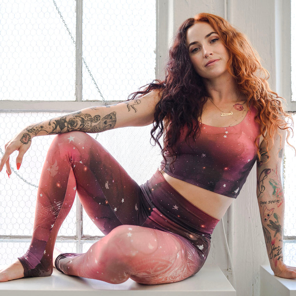 Girl sitting casually while wearing WERKSHOP Galactic Solar Flare Athleisure Set.