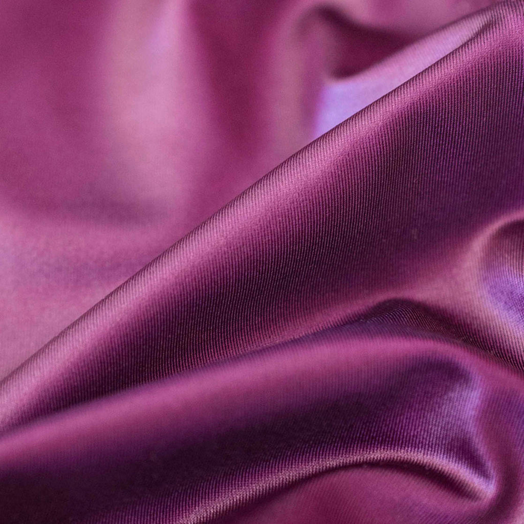 Zoomed-in shot of our luster fabric in color: eggplant