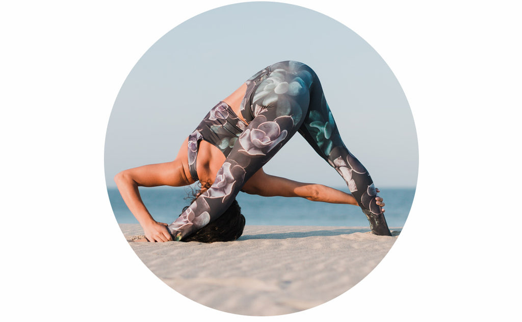 girl doing a triangle variation yoga pose while wearing Midnight Garden Athleisure Set