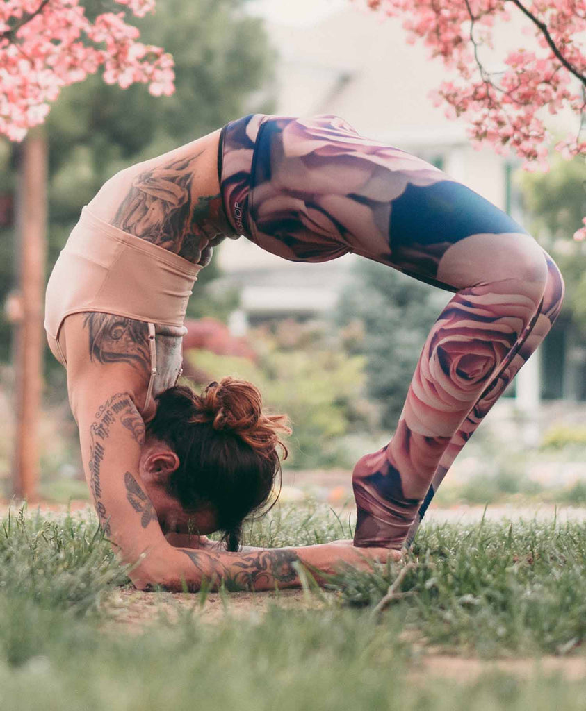 girl doing an advanced yoga pose while wearing WERKSHOP Blush Leggings
