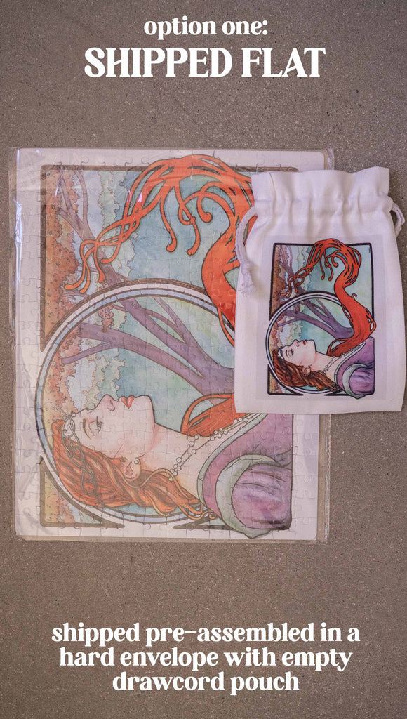 Zoomed in photo of Art Nouveau puzzle by Scott Christian Sava. The painting features a woman wearing a crown and pearls with long flowing red locks; stnading in front of a round window. Option 1: Shipped pre-assembled in a hard envelope with empty drawcord pouch