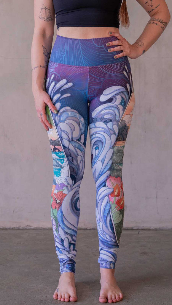 Model wearing WERKSHOP Surfboard leggings featuring Model wearing WERKSHOP Onyx leggings featuring original and exclusive polygon artwork that has a dark gray and black at the waistband to light gray ombre fade below the knee. The design is asymmetrical with the WERKSHOP eagle logo is on the wearers left hip. 
