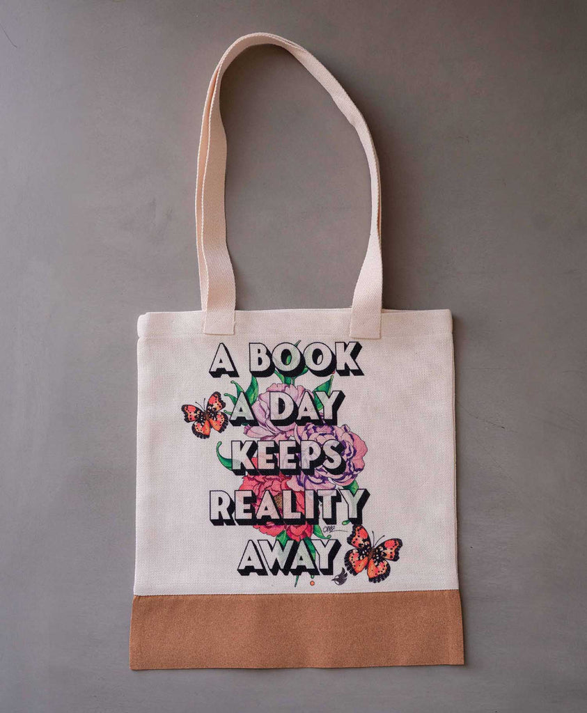 WERKSHOP Tote Bag printed with the saying: A Book A Day Keeps Reality Away