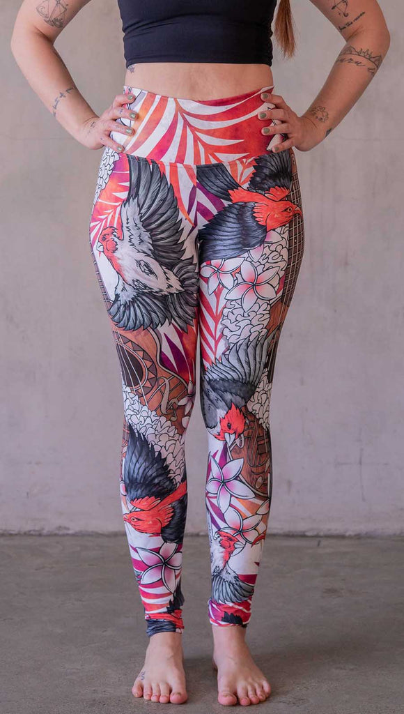 Model wearing WERKSHOP Ukulele leggings featuring original and exclusive artwork of a Ukulele and tropical birds with flower lei and bright palm fronds. 