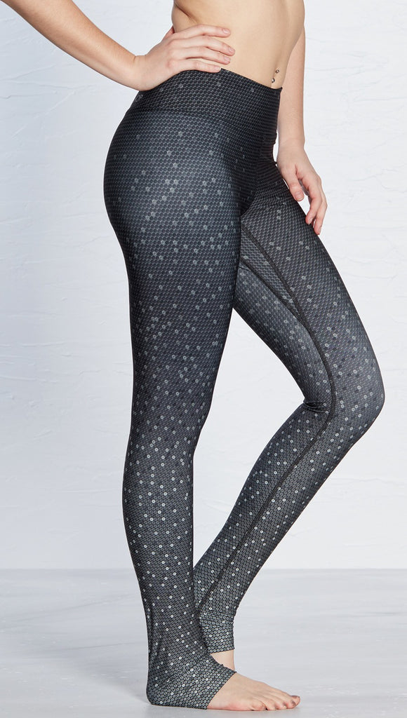 close up side view of model wearing black ombre beaded printed full length leggings