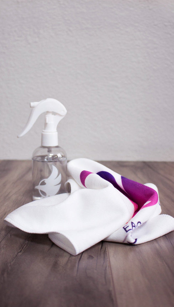 View of spray bottle and towel with eagle logos