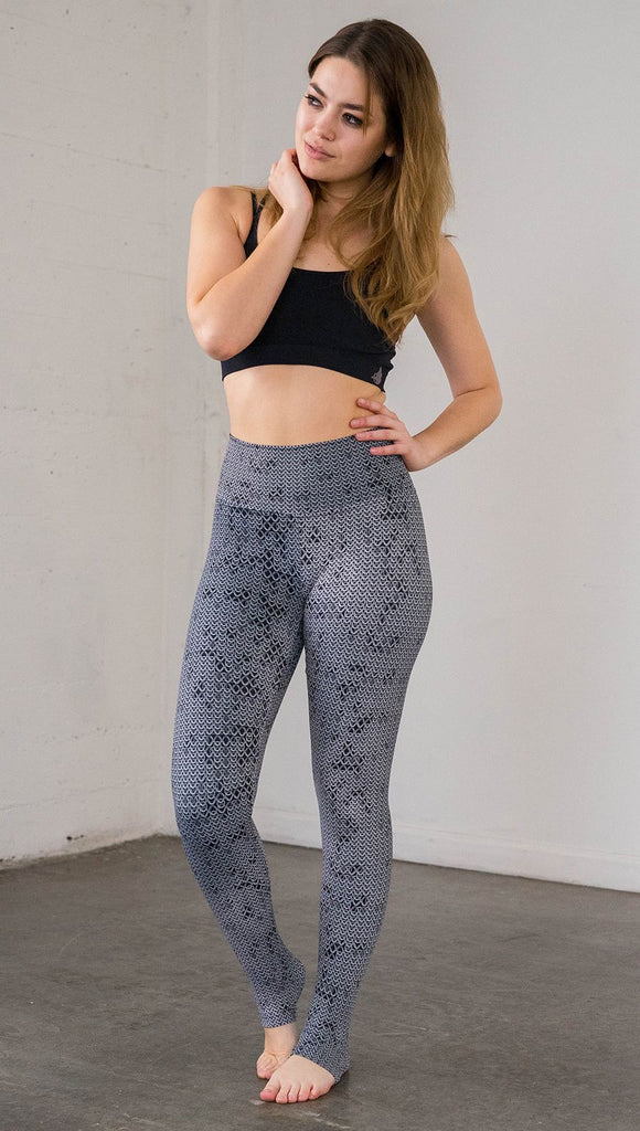 Front view of model wearing chainmaille inspired full length leggings
