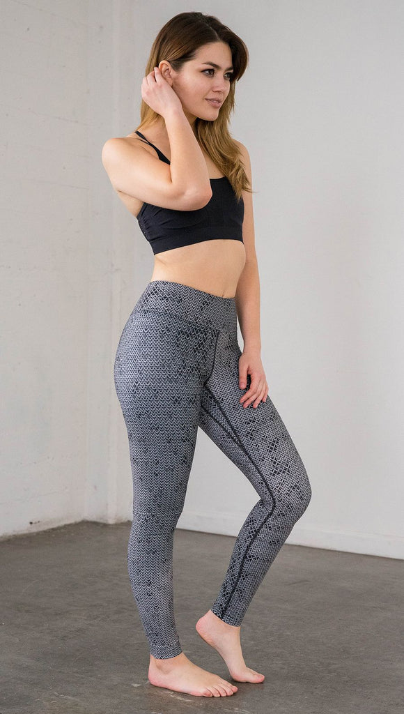 Right side view of model wearing chainmaille inspired full length leggings